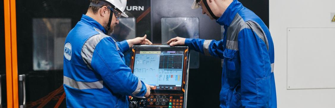 Engineers reviewing a control system