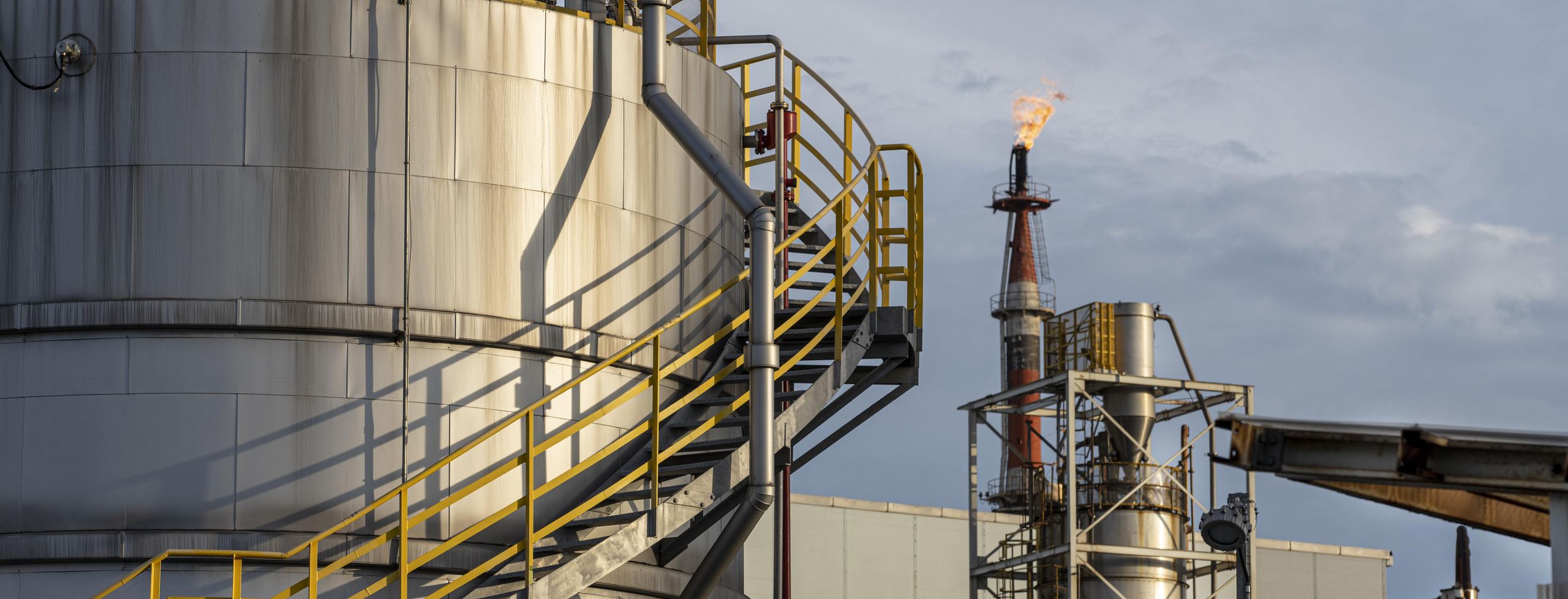 Refinery process units at dusk