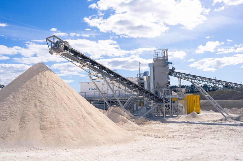 Conveyor and stockpile at an aggregate processing plant