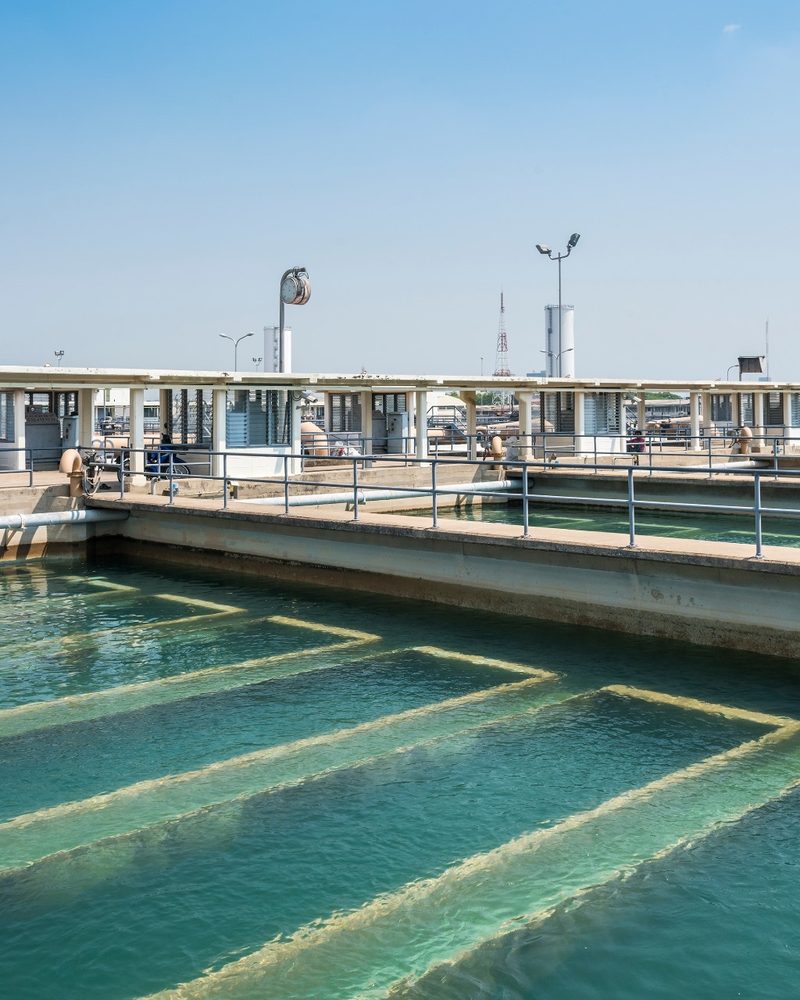 Rectangular clarifier basins with walkways at a wastewater treatment plant