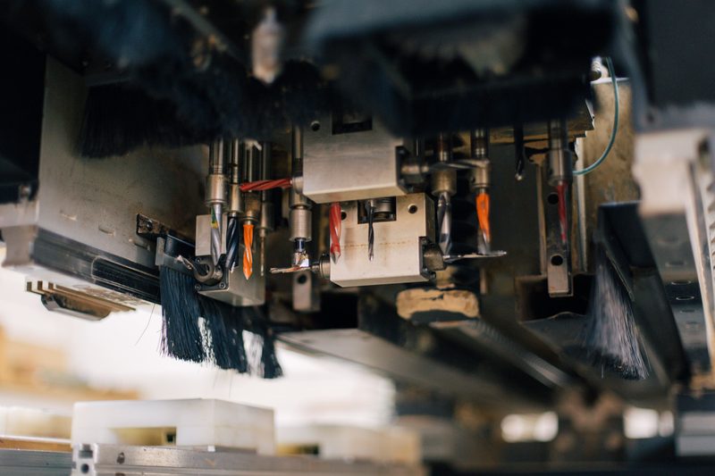 Close view of the tooling under an industrial press
