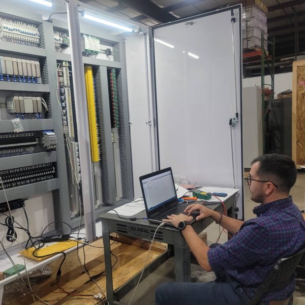 Engineer commissioning a control system at a command station