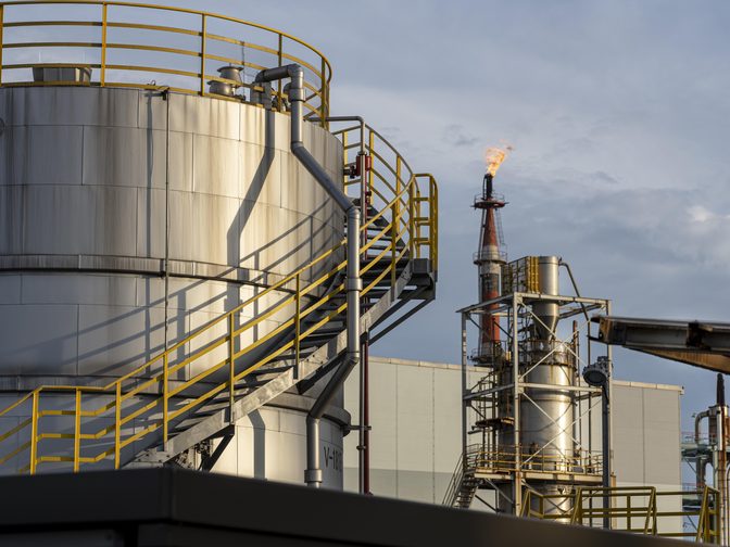 Refinery process units at dusk